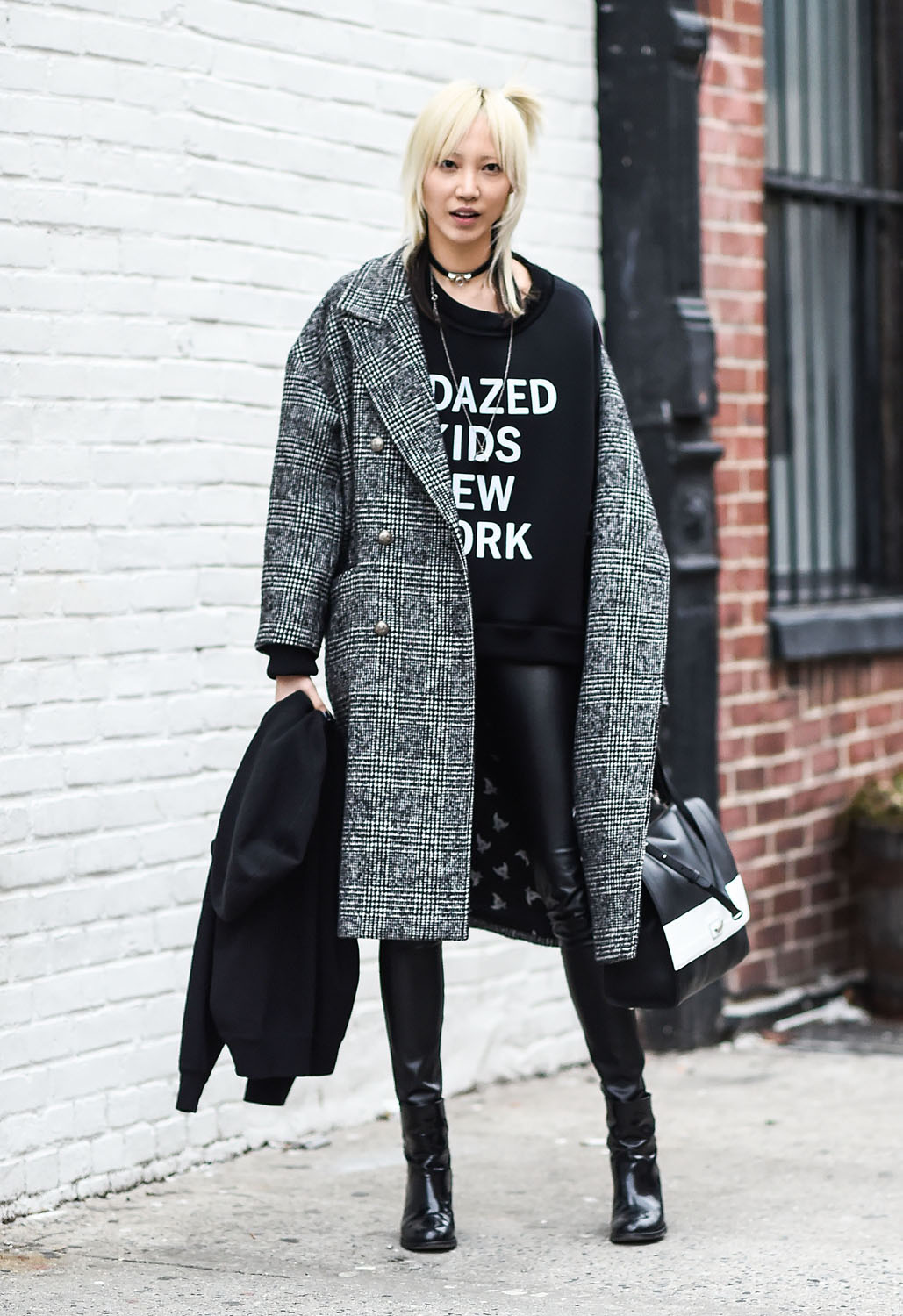 NEW YORK, NY - FEBRUARY 17: Soo Joo Park is seen outside the DKNY show wearing a DKNY sweater during New York Fashion Week: Women's Fall/Winter 2016 on February 17, 2016 in New York City. (Photo by Daniel Zuchnik/Getty Images)