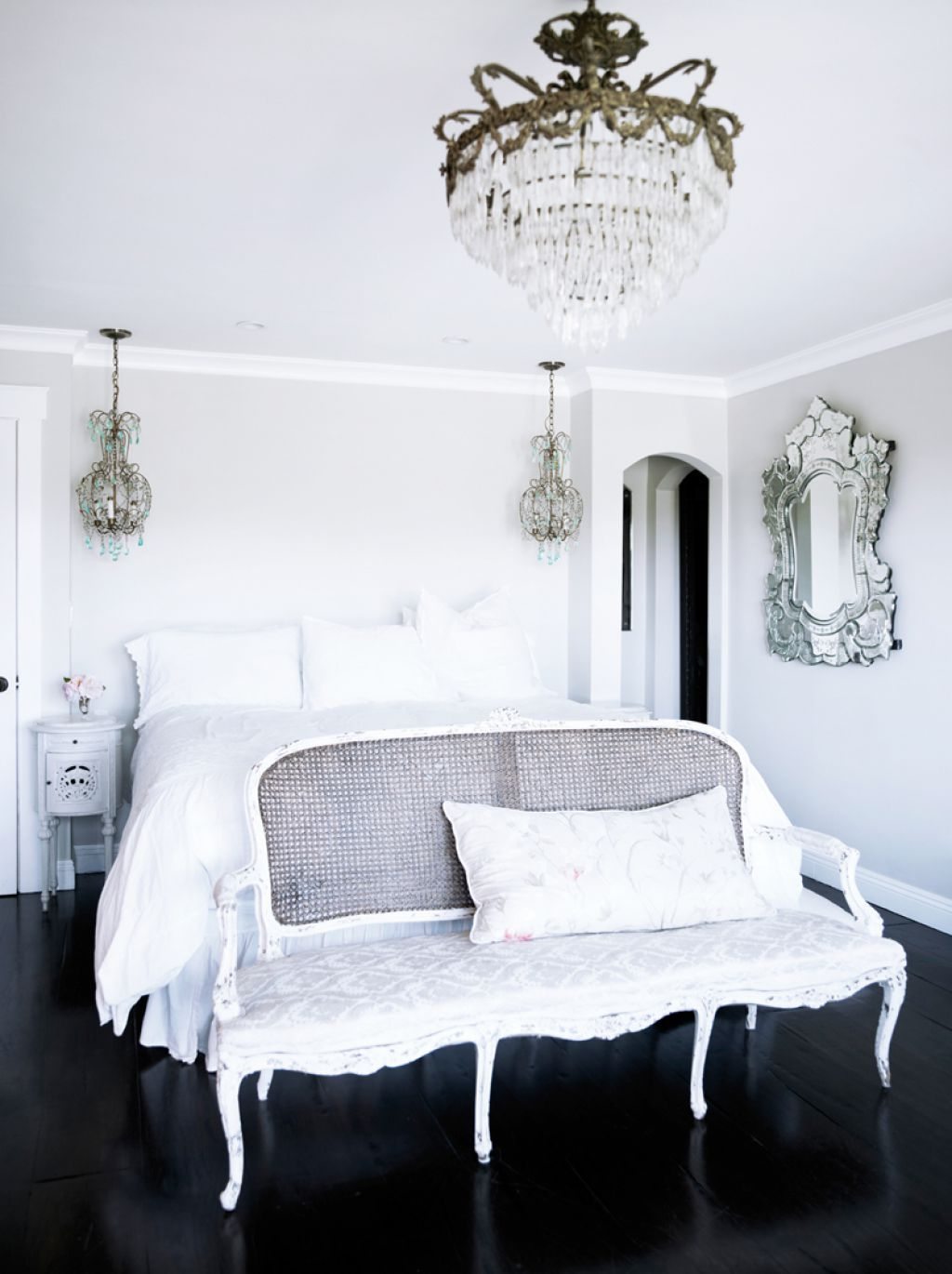 bedroom-with-crystal-chandeliers-and-venetian-mirror